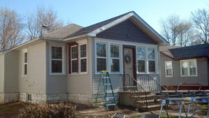 Custom windows, siding, and roofing by Custom Quality Renovations.