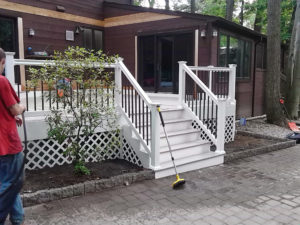 Custom wooden deck with stairs by Custom Quality Renovations.